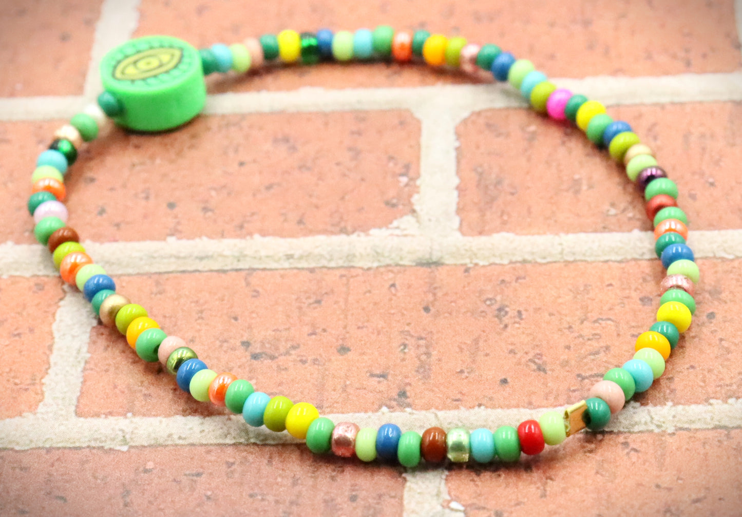 Green Eye of Envy Evil Eye Charm Colorful Seed Bead Stretch Bracelet by Monkey's Mojo