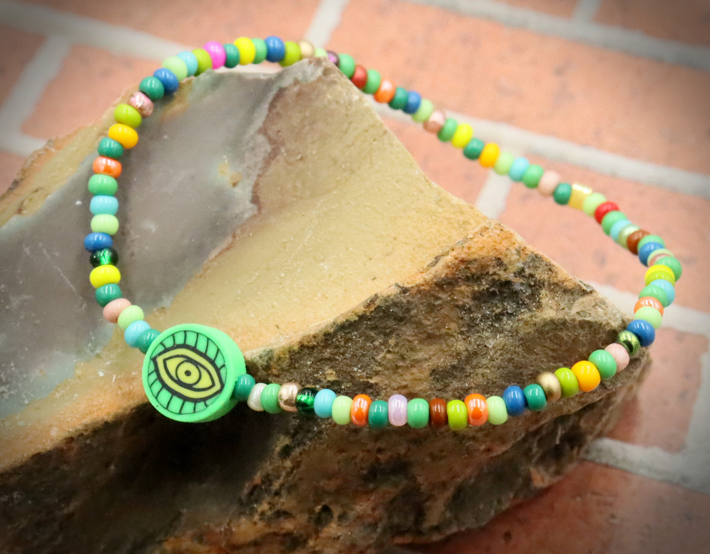 Green Eye of Envy Evil Eye Charm Colorful Seed Bead Stretch Bracelet by Monkey's Mojo