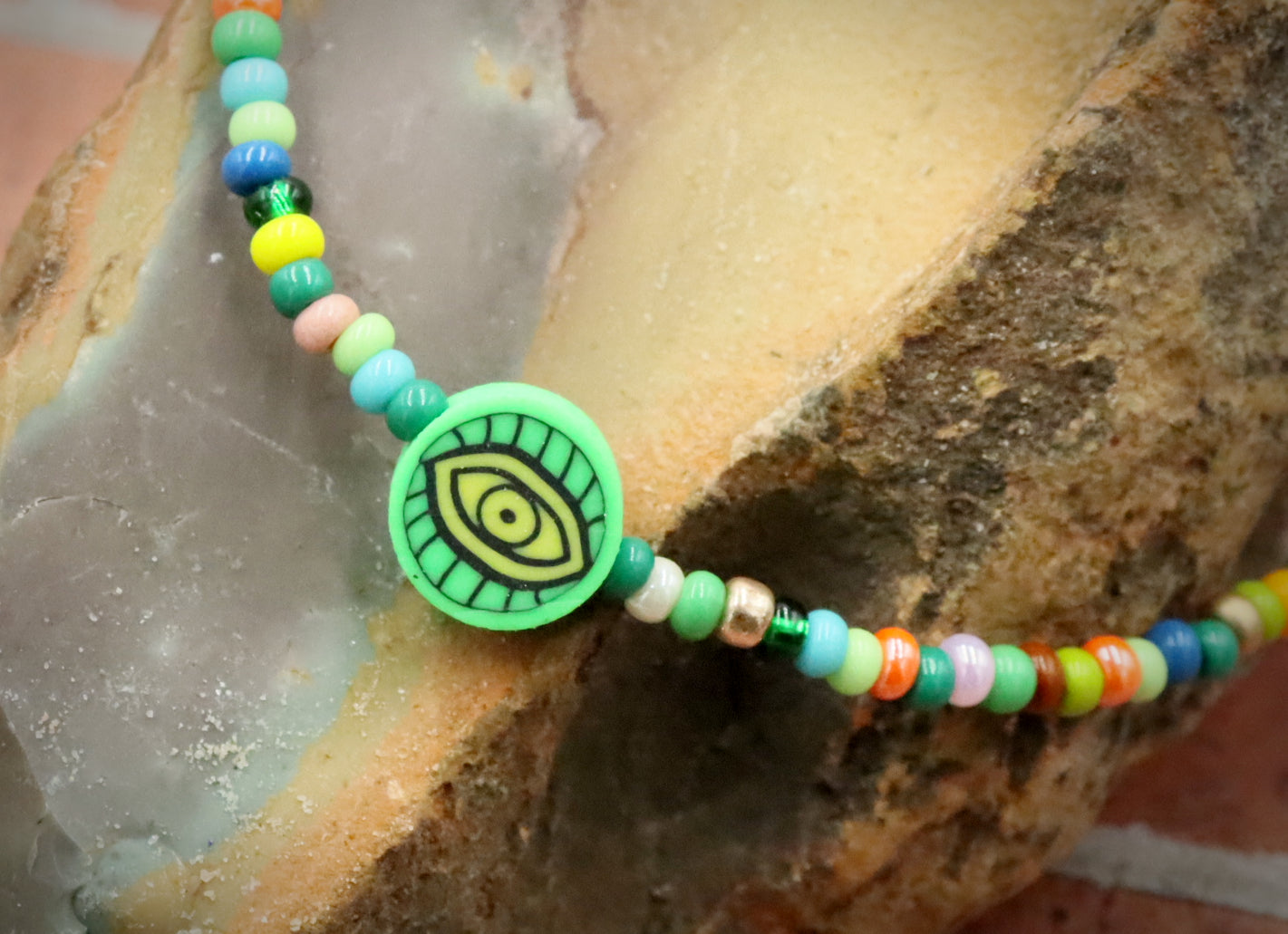 Green Eye of Envy Evil Eye Charm Colorful Seed Bead Stretch Bracelet by Monkey's Mojo