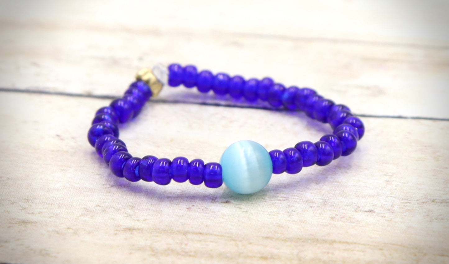 Cat's Eye On the Price - Synthetic Cat's Eye and Blue Glass Bead Stretch Ring by Monkey's Mojo