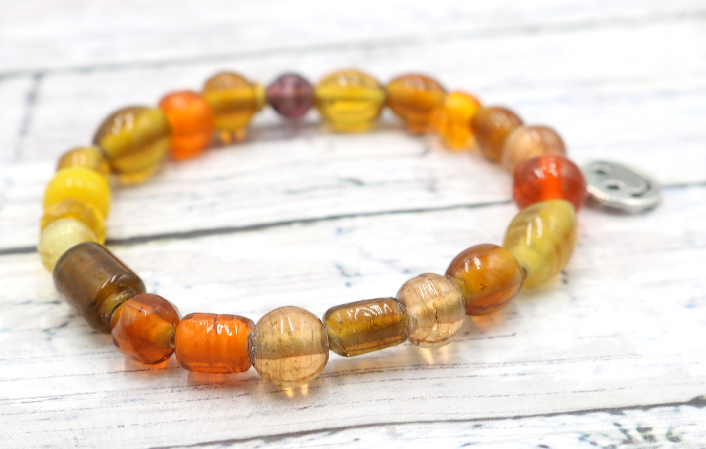 Yellow Hued Warm Artisan Glass Beads Bracelet with Silver Smile Face Charm by Monkey's Mojo