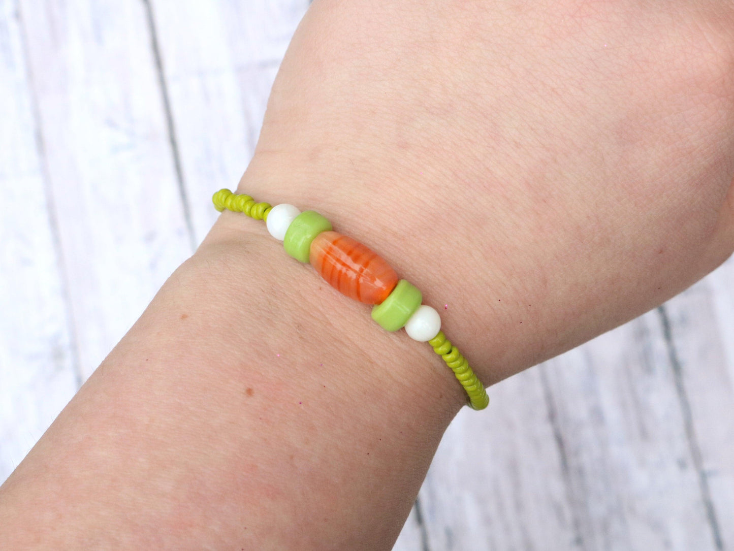 Bunny Hop Carrot Love Easter Treat Orange and Green Glass Bracelet On Model