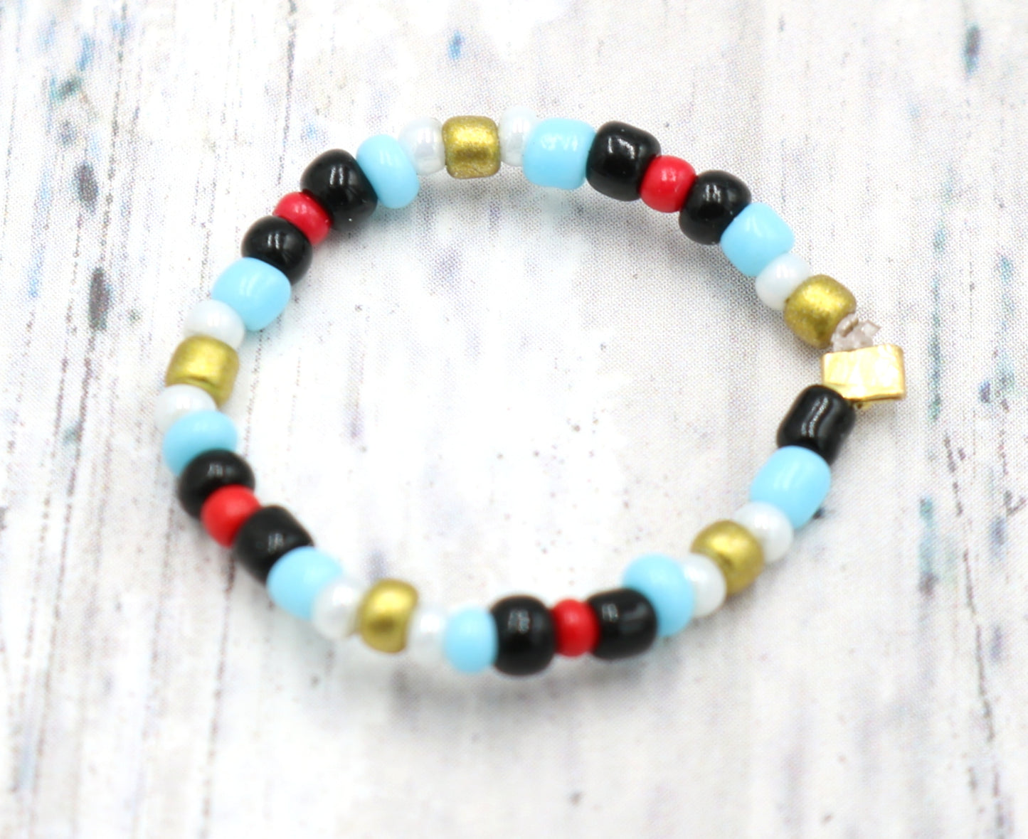 Pointing Your Finger Like an Egyptian Smooth Walking Glass Bead Stretch Stack Ring by Monkey's Mojo