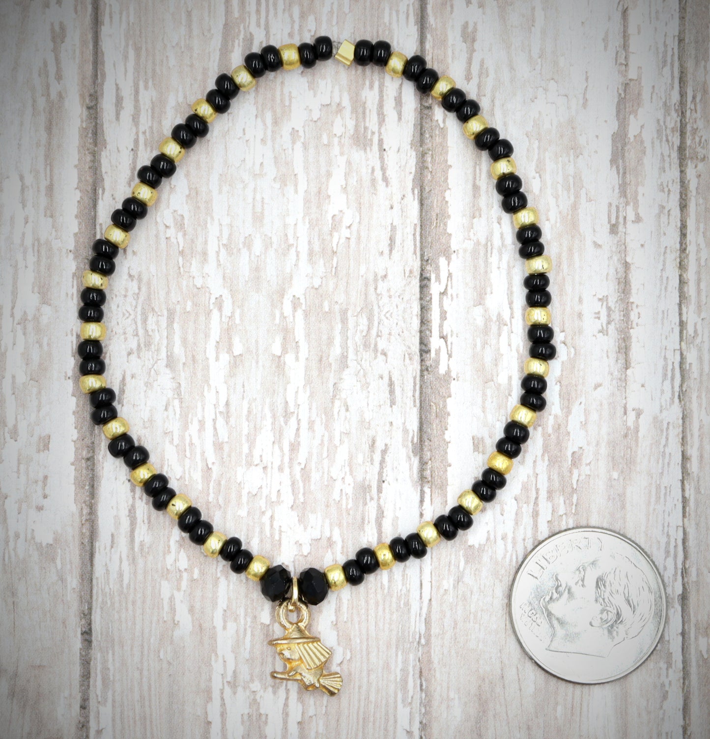 Little Wicked Witch Flying on a Broom Black and Gold Halloween Stretch Bracelet by Monkey's Mojo